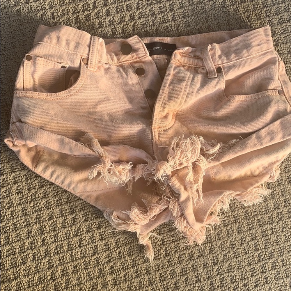 Salmon colored cut off denim shorts